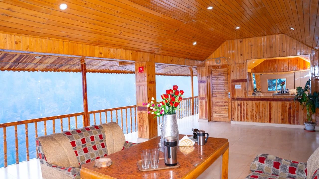 Wooden common area lounge at Kanyal Heights