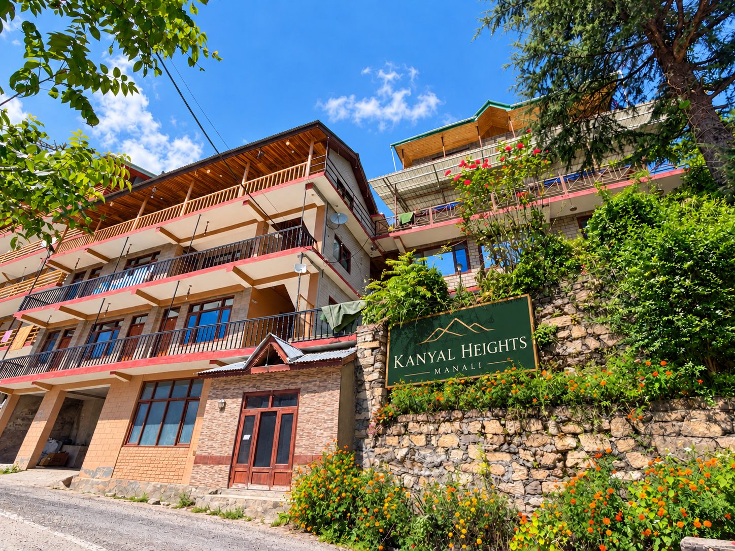 Kanyal Heights hotel exterior with signboard